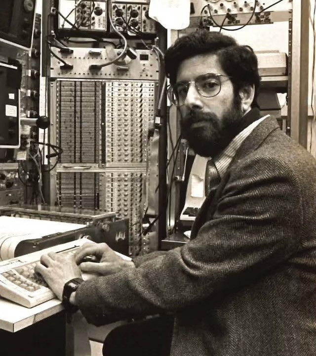 A younger Dr. Richard J. Davidson at a lab computer among instrument racks